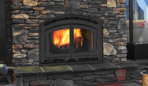 A fireplace with fire burning in it.