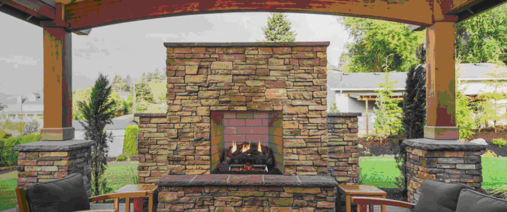 A fireplace with brick and stone on the outside.