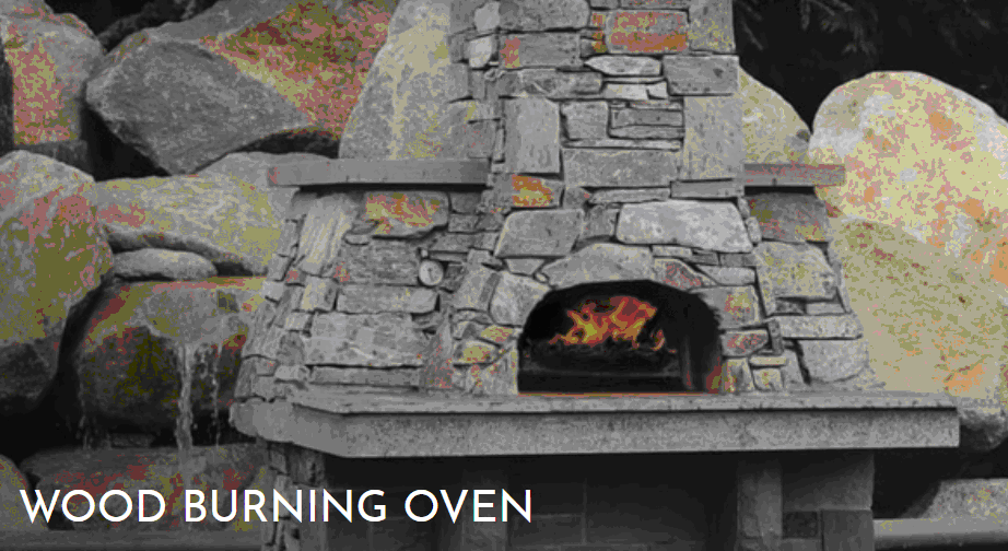 A brick oven with fire burning in it.
