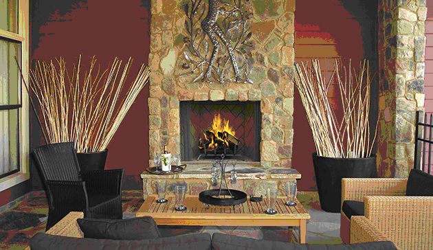 A fireplace with a fire place and some sticks