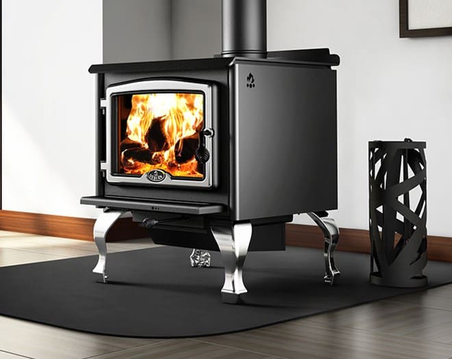 A black stove sitting on top of a rug.